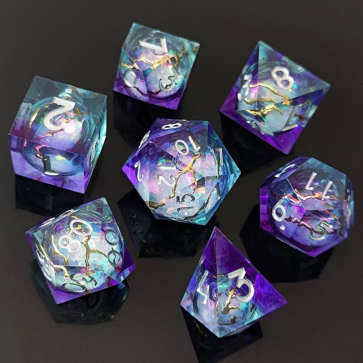 Astral Rift 7-piece liquid core resin RPG dice set with purple and aqua tones on a black background.