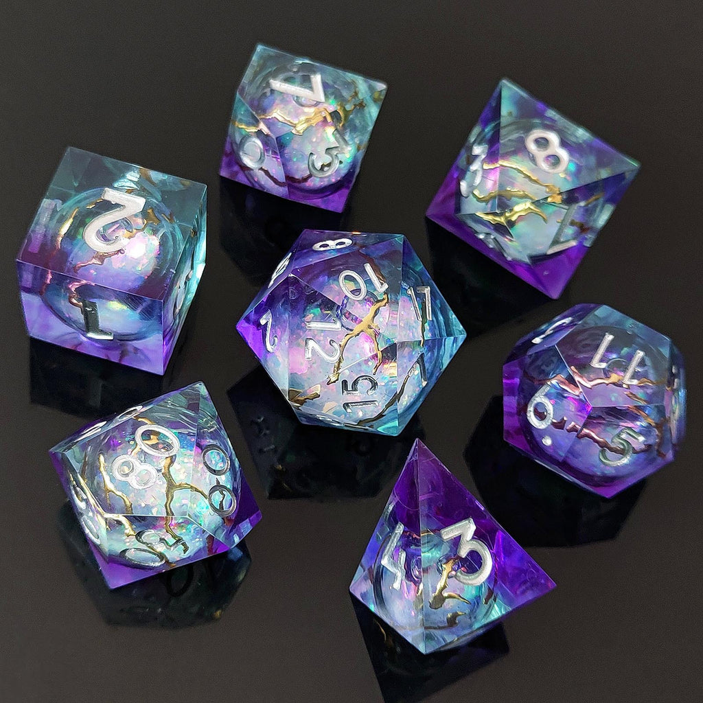 Angled view of the Astral Rift liquid core resin dice showing purple, aqua, and gold-rift details.