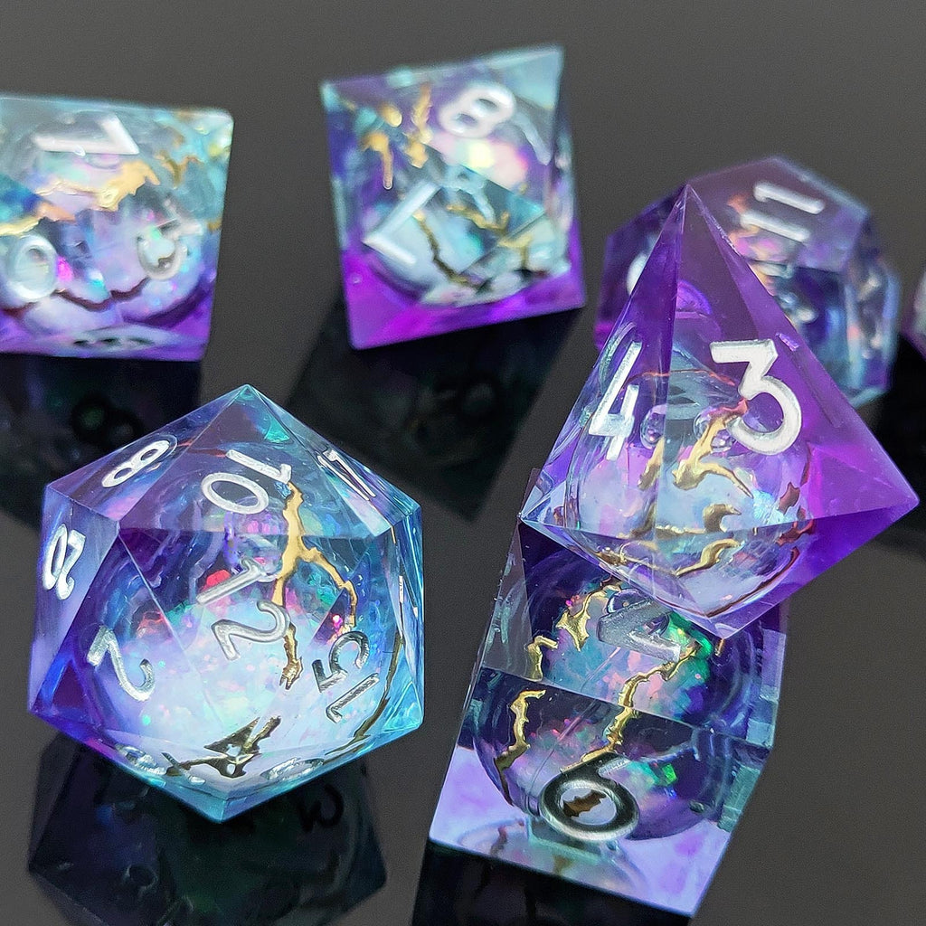 Close-up of Astral Rift liquid core RPG dice with white numerals and shifting iridescent cores.